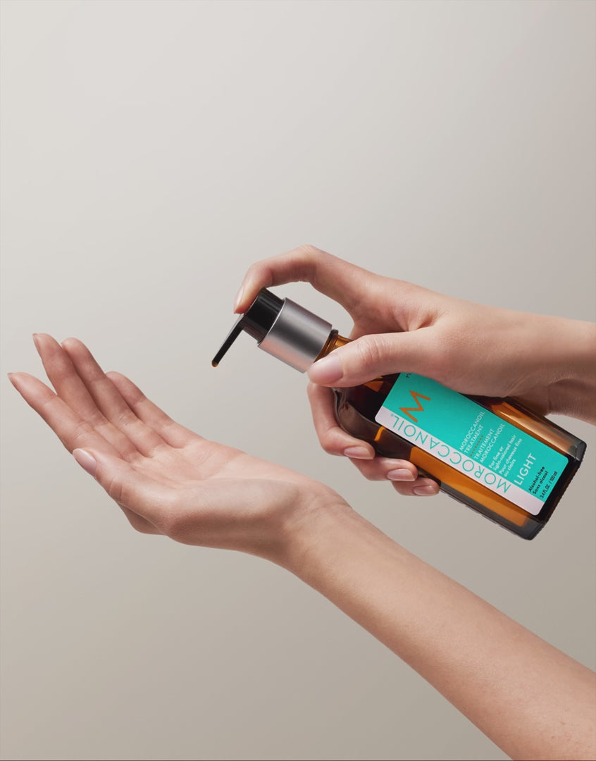 Load video: MOROCCANOIL Treatment Oil Light